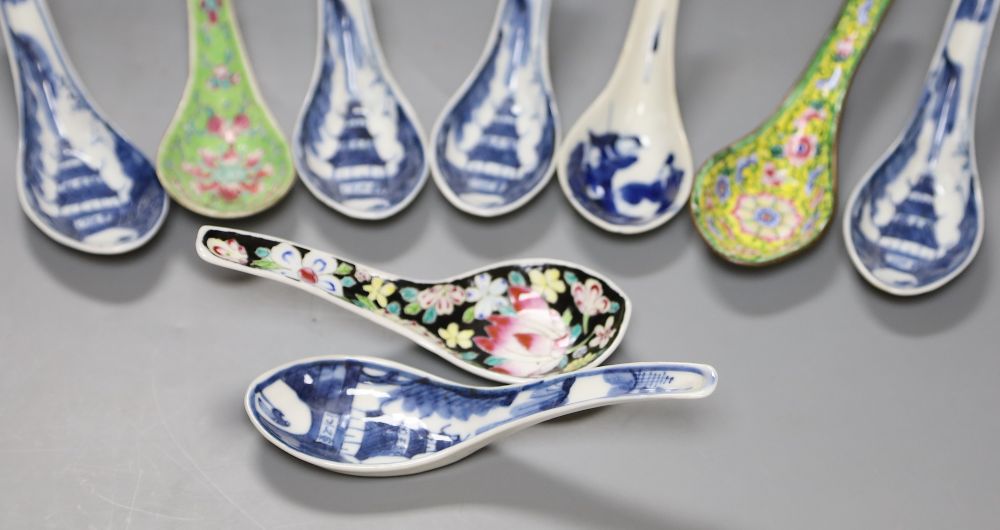 Six Chinese blue and white rice spoons, a famille rose spoon and a Canton enamel spoon